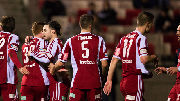 Hume City players celebrate a goal in their win over Kingston City.